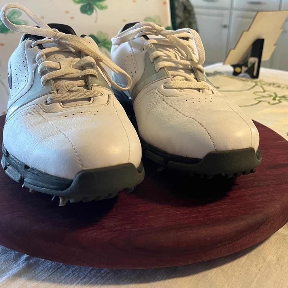 Nike White and Black Women’s Golf Shoes with cleats.  Red Swoosh